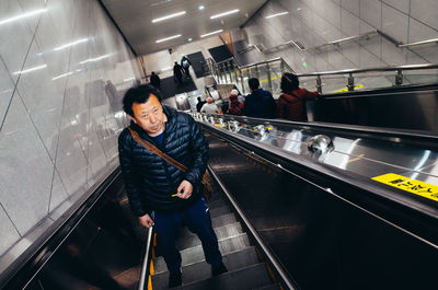 People standing on escalator