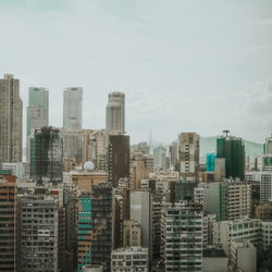Modern buildings in city against sky
