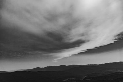 Scenic view of silhouette mountains against sky