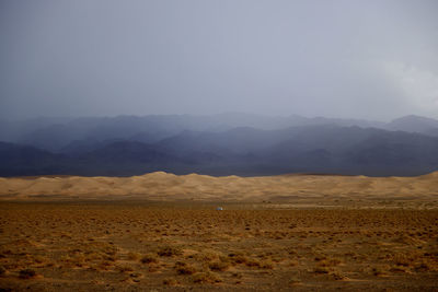 Scenic view of desert against clear sky