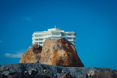 Low angle view of building against blue sky