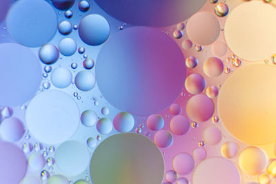 Colorful photo of oil on water with circle shape, abstract photo