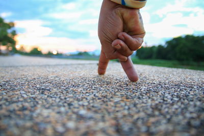 Close-up of hands on pebbles