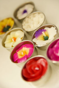 Tilt shot of colorful tea lights on table