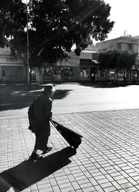 Woman standing on sidewalk