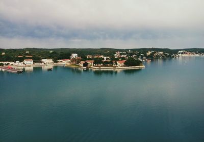 Panoramic view of townscape and sea against sky