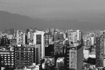 High angle view of buildings in city against sky