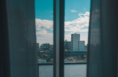 Buildings seen through window