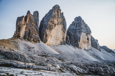 Low angle view of rocks against sky