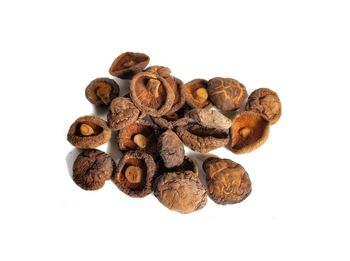 Close-up of coffee beans against white background