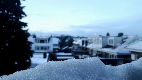 Close-up of cityscape against sky during winter