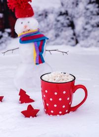 Close-up of marshmallow in mug on snow