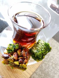 High angle view of baklava with black tea on table 