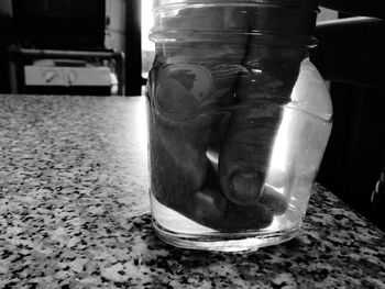 Close-up of glass jar on table