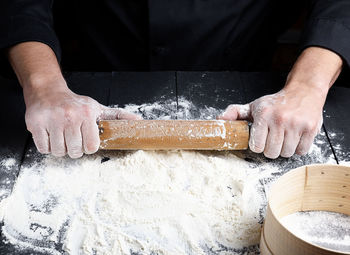 Midsection of person preparing food