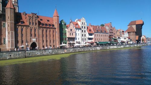 View of river in front of buildings