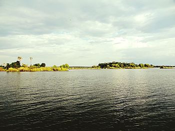 Scenic view of sea against cloudy sky