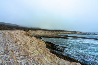 Scenic view of rocky shoreline in montaña de oro state park near los osos, california.