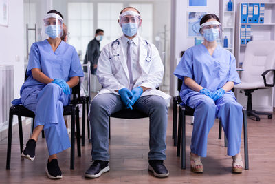 Group of people sitting in corridor