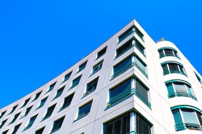 Low angle view of building against clear blue sky