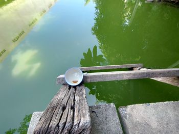 High angle view of wooden post in lake