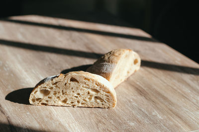 High angle view of bread on cutting board