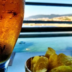 Close-up of drink on glass window