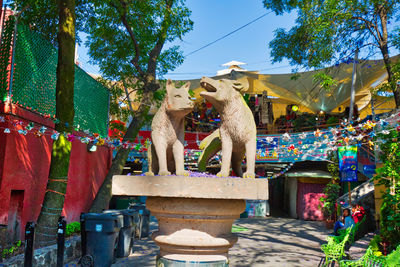 View of statues at market stall