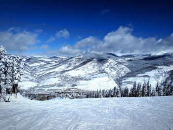 Scenic view of snowcapped mountains against sky