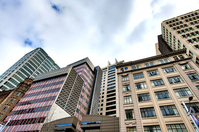 Low angle view of modern buildings against sky