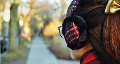 Close-up of woman wearing ear muff