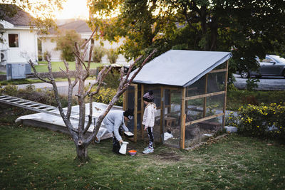 Mother and daughter working in garden