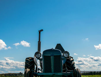 Old tractor against blue sky