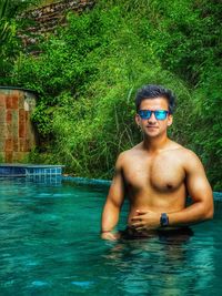 Portrait of young man in swimming pool
