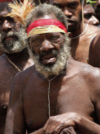 Close-up portrait of shirtless man