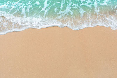 High angle view of surf on beach