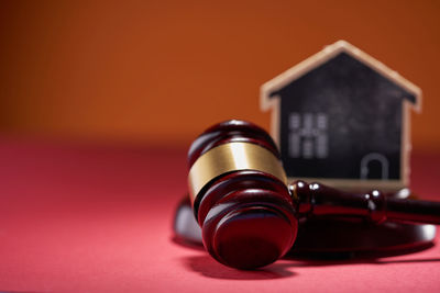 Close-up of gavel on table