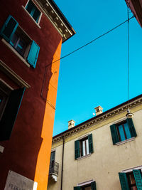 Low angle view of building against blue sky