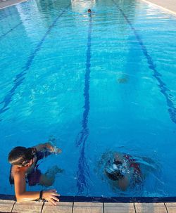 High angle view of woman swimming in pool