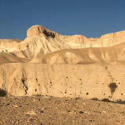 Scenic view of desert against clear sky