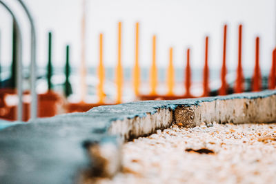 Close-up of wood on beach against sky