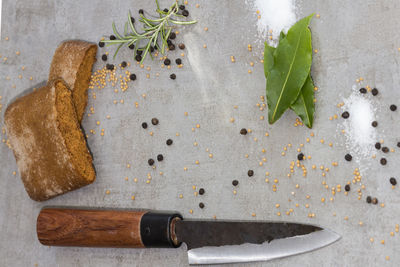 Close-up of food with spice and knife on cutting board