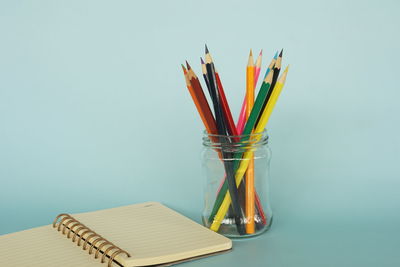 Close-up of multi colored pencils on table