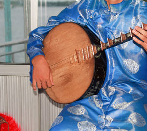 Close-up of man playing guitar