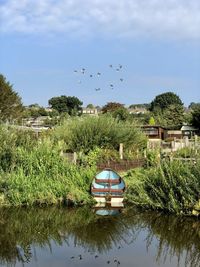 Scenic view of canal against sky