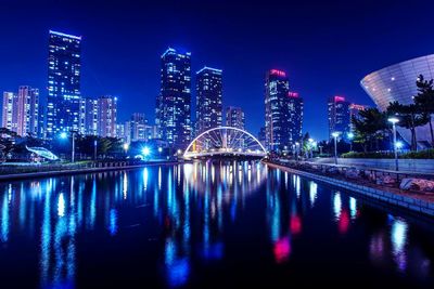 Illuminated city buildings at night