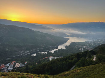 Scenic view of mountains against sky during sunset