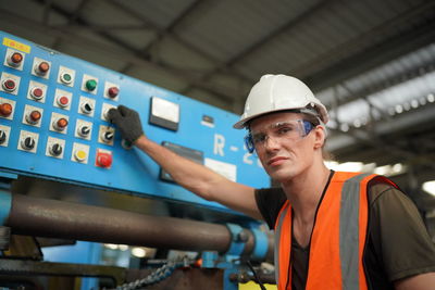 Portrait of man working in factory