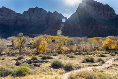 View of landscape with mountain range in background