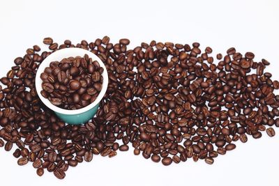 Close-up of coffee beans against white background